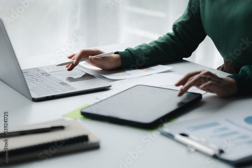 Business men are looking at the company's financial documents on tablets to analyze problems and find solutions before bringing the information to a meeting with a partner. Financial concept.