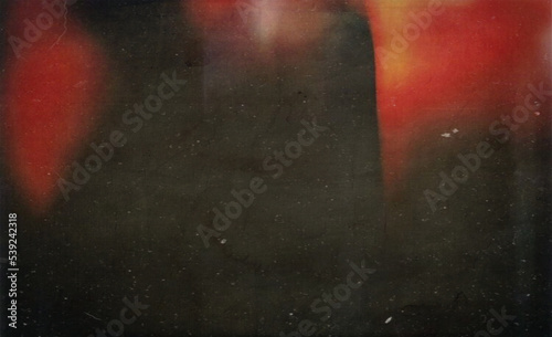 Film texture background with heavy grain, dust and light leakage developed on paper