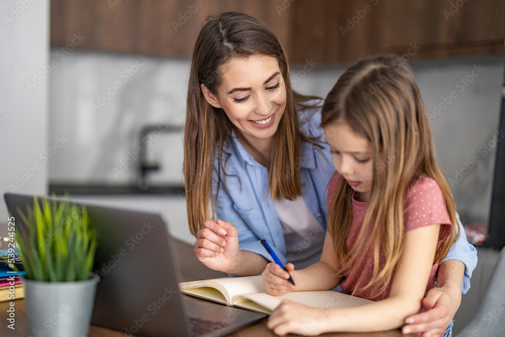Mom helping kid with homework Mom helping kid with homework