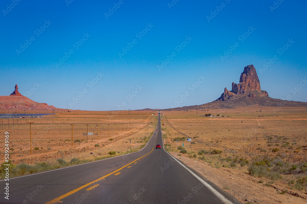 Fototapeta premium Highway Road U.S. Highway 163 and Monument Valley at sunset, Arizona, USA