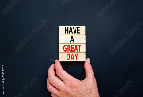 Have a great day symbol. Concept words Have a great day on wooden blocks. Beautiful black table black background. Businessman hand. Business, psychological Have a great day concept. Copy space.