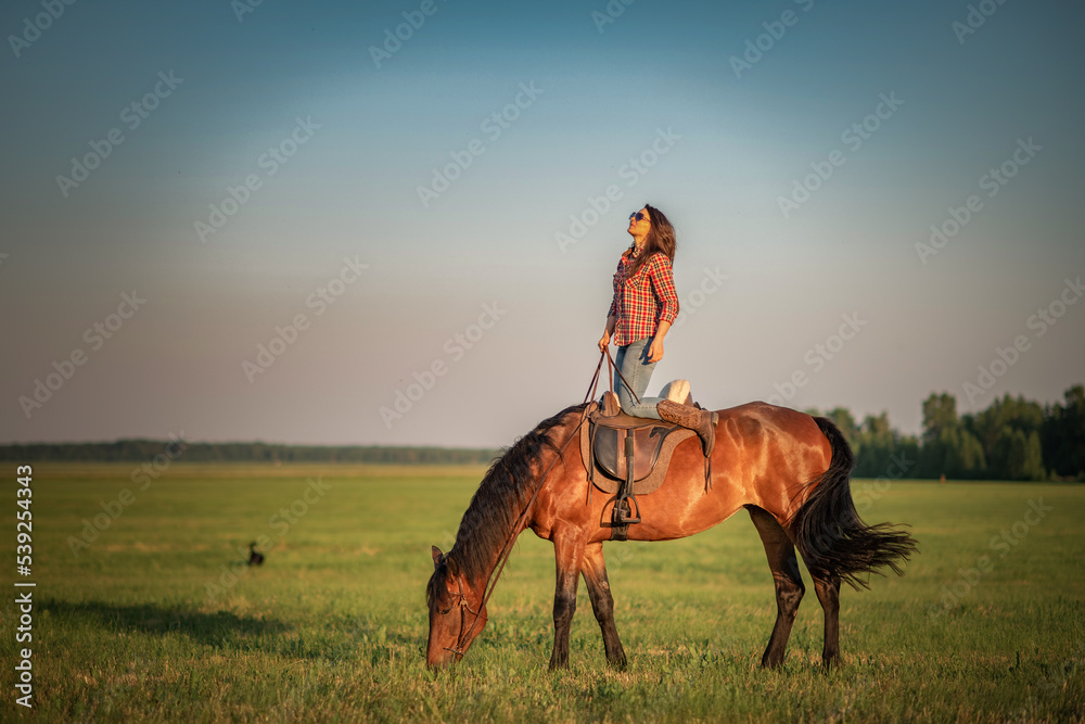 Young beautiful dark-haired girl on a horse. There is artistic noise. Young beautiful dark-haired girl on a horse. There is artistic noise.