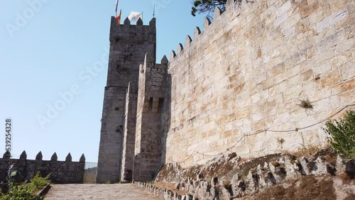 Baiona, Spain, August 26, 2022: DOLLY - The Fortified Clock Tower next to the Royal Gate of the Historical Castle of Monterreal on the Monte Boi peninsula in the Galician village of Baiona, Spain.  photo