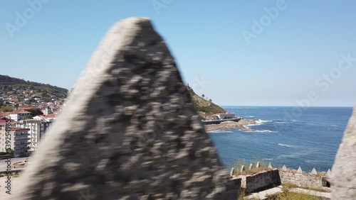 DOLLY SHOT - The Monterreal Fortress on the Monte Boi peninsula in the Galician village of Baiona, Galicia, Spain. photo