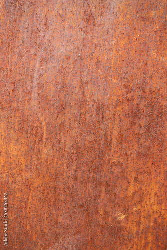 Orange red old rusty metal surface. Weathered rusted metal wall texture and structure