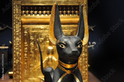 Anubis as a guard in front of a burial chamber of a pharaoh