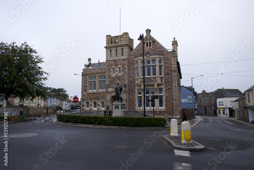 Camborne Cornwall UK 10 18 2022 Passmore Edwards library of 1895 with statue of Trevithick. Edwards was a Cornish born philanthropist who funded several public buildings accross Cornwall.  photo