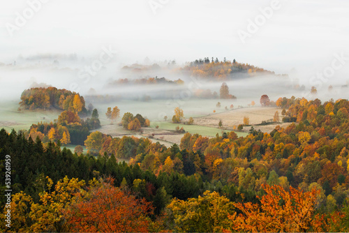 Autumn colors surrounded by mountains 