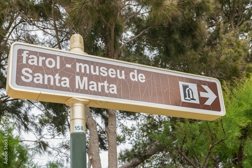 Direction sign on the Santa Marta Museum Lighthouse in Cascais, Portugal photo