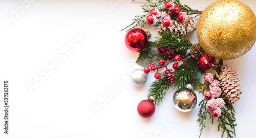 Christmas frame. Spruce branches, Christmas balls and beads. Preparation for the New Year. Christmas background for presentation of work or text. Flat lay, top view, copy space, mock-up