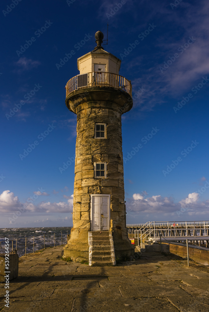 Obraz premium The Stone Lighthouse on the East Pier, Whitby, North Yorkshire