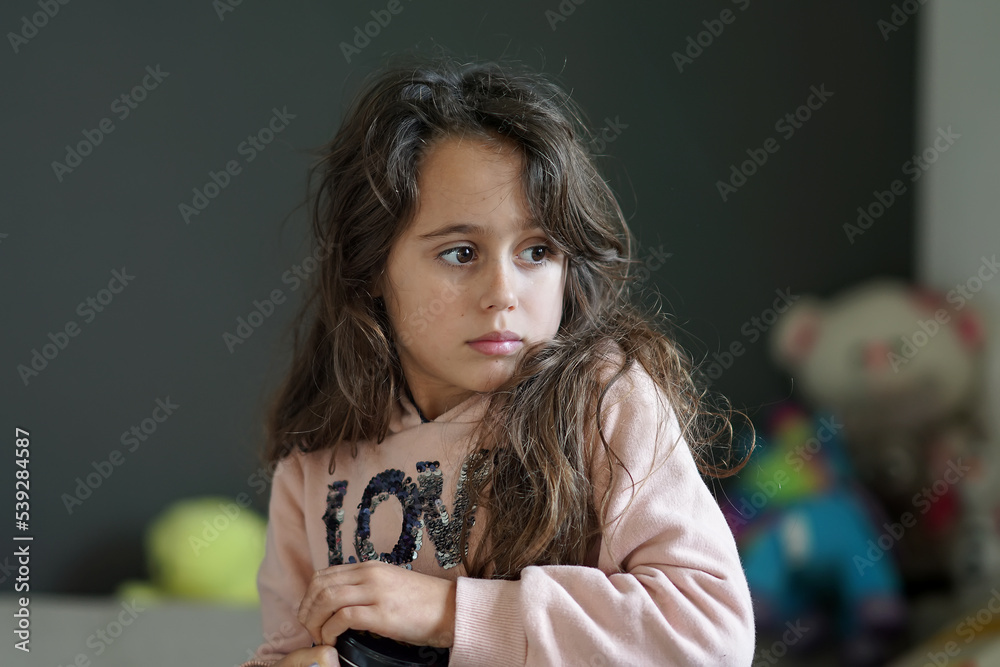 Young girl 6-7 years old looking