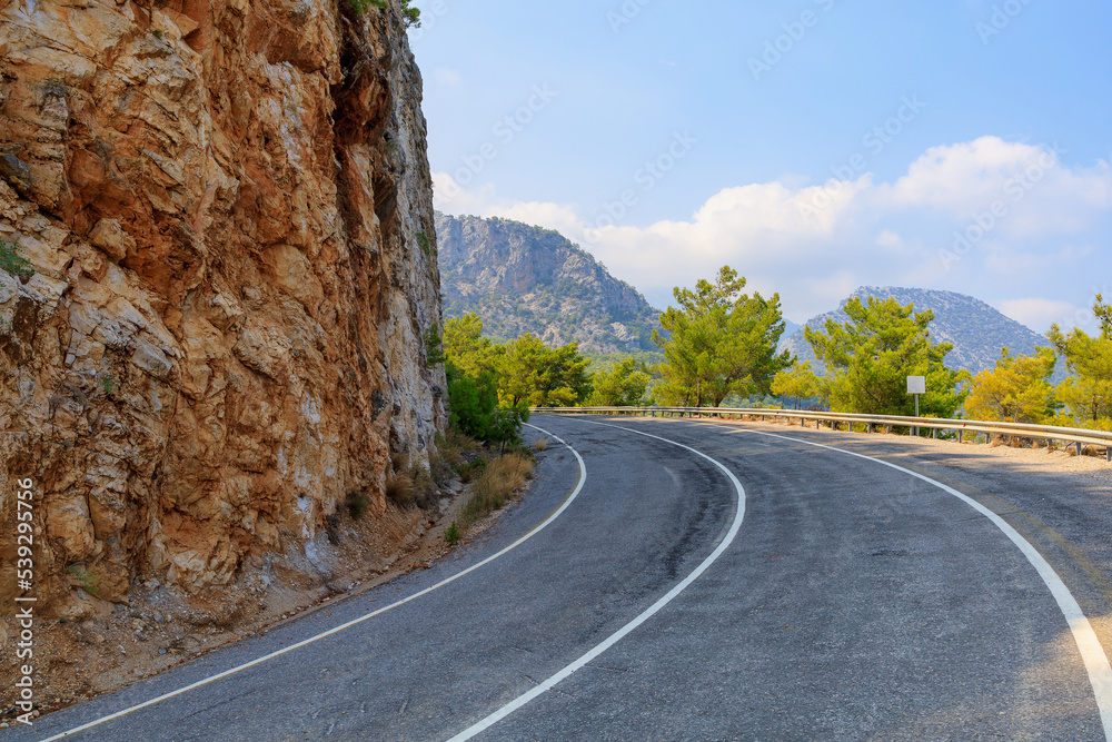 Mountain road near the sea coast. Background with copy space
