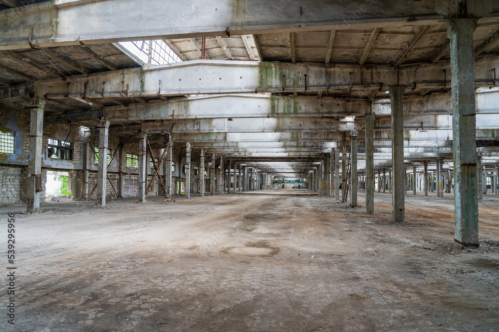 Ruined industrial area, abandoned ruins of a plant or factory. Huge vacant lot. Background Ruined industrial area, abandoned ruins of a plant or factory. Huge vacant lot. Background