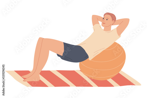 Man doing fitness exercises with fit ball at home