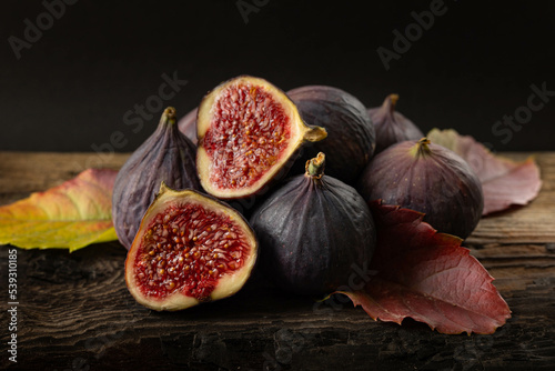 Fresh figs on wooden table. photo