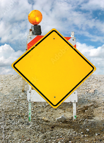 Blank Yellow Caution Sign On Construction Horse