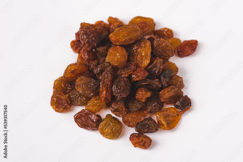 Black, yellow and brown raisins isolated on white background. Top view. Flat lay. Set or collection