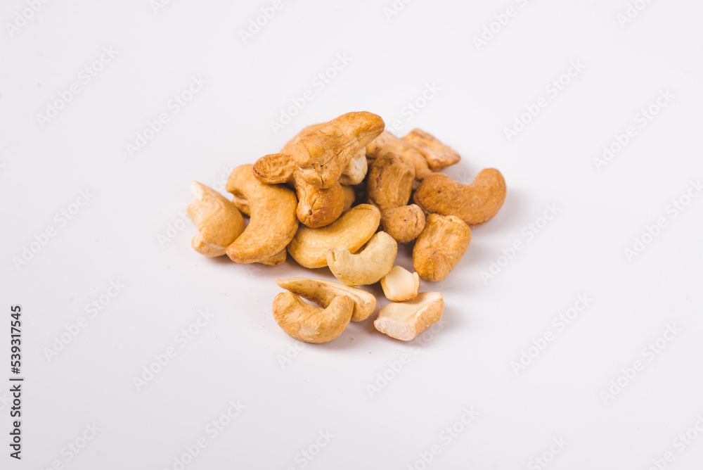 Fototapeta premium Tasty cashew nuts as background, top view