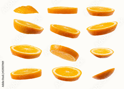 Twelve slices of oranges isolated on white background