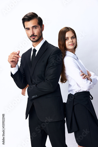 Man and woman smile with teeth business in business attire looking into camera on white isolated background. Stylish business concept paired between employees startup copy space