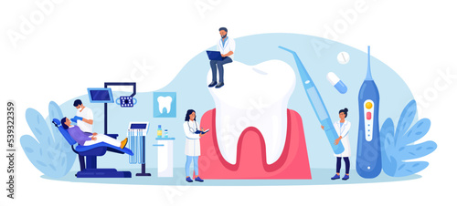 Dentist appointment, stomatology. Dental checkup, teeth care procedures. Teeth whitening and professional cleaning. Cosmetic dentistry. Dentist doctor in uniform treating tooth using medical equipment