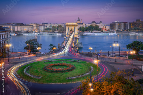 Aerial view of traffic at Clark Adam Square roundabout with Szechenyi Chain Bridge and Danube river - Budapest, Hungary