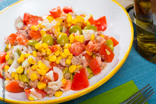 Salad with canned tuna, olives and corn. High quality photo