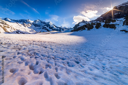 Snowcapped mountains, Alpine landscape at golden sunset, Gran Paradiso, Italy
