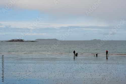 Fishermen on a beach in Brittany France