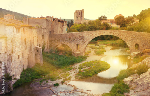 Medieval vaulted arch bridge over Orbieu river in Lagrasse, France..