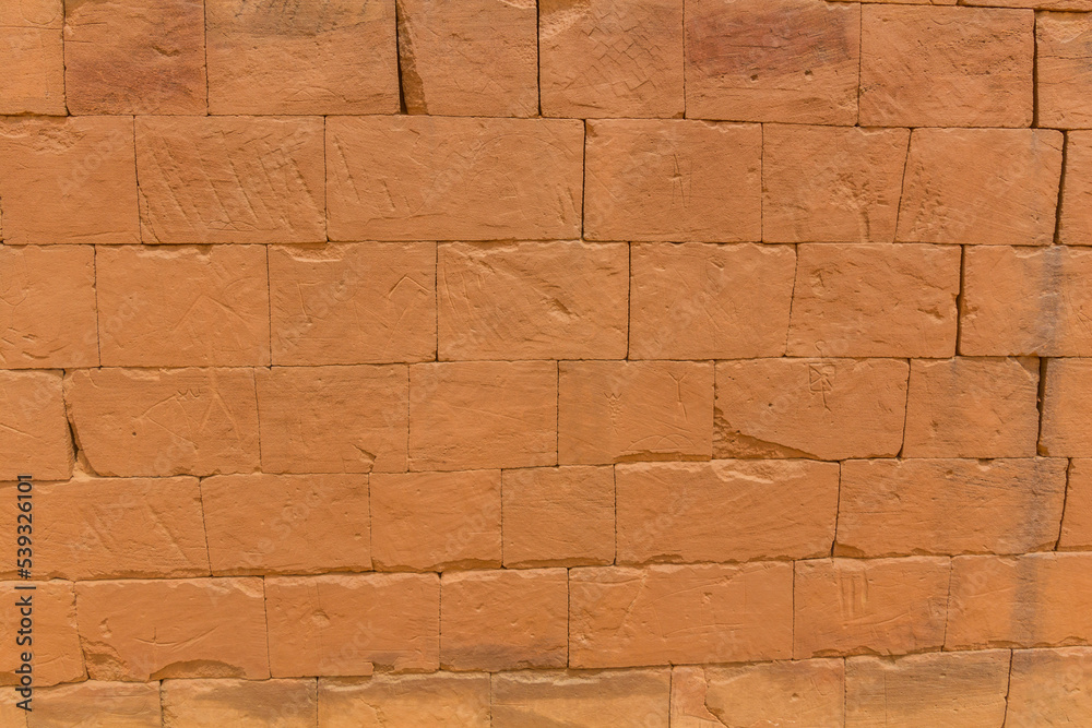 Obraz premium Ancient carvings in the walls of the Great Enclosure of Musawwarat es-Sufra (Musawarat Al-Sufra) in Sudan