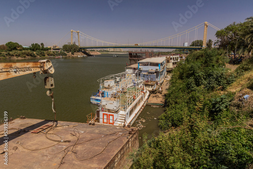 Boats and Tuti island bridge in Khartoum, capital of Sudan photo