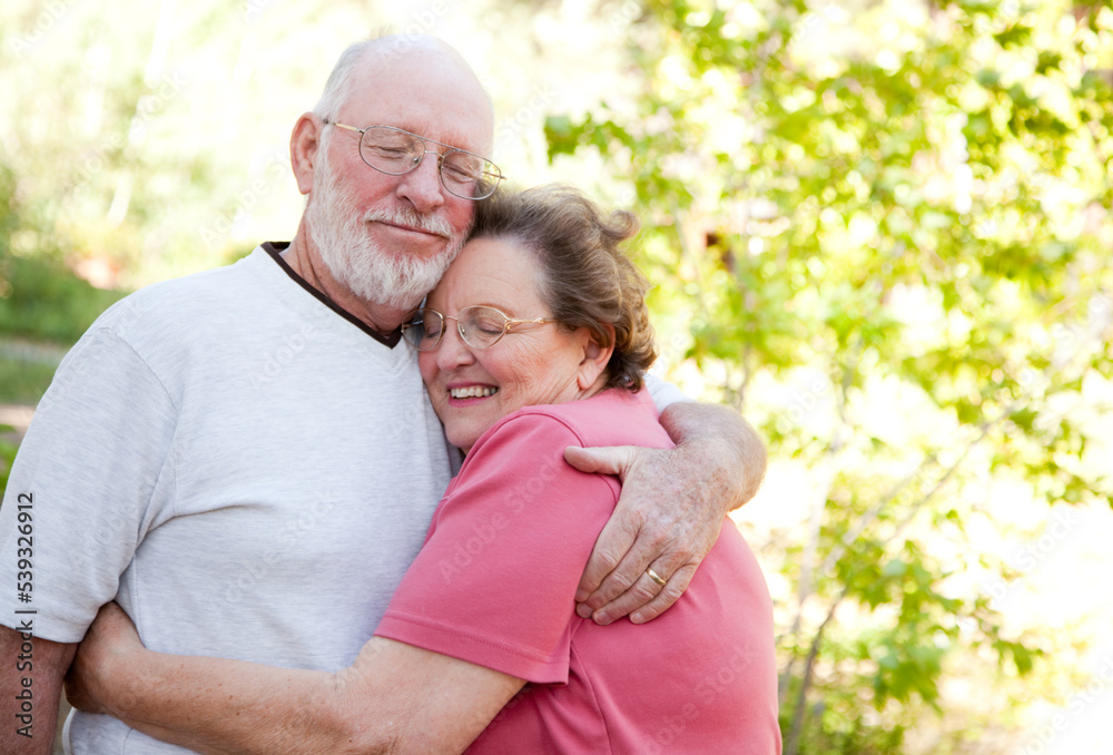 Obraz premium Loving Senior Couple Embracing Outdoors