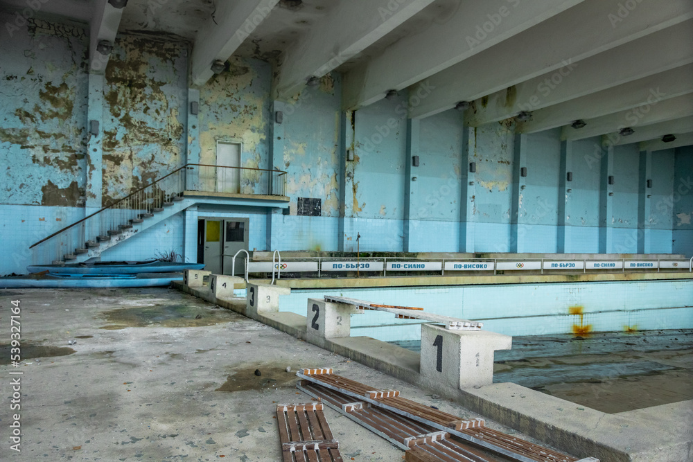 Derelict building indoors with abandoned swimming pool like Chernobyl, Bulgaria