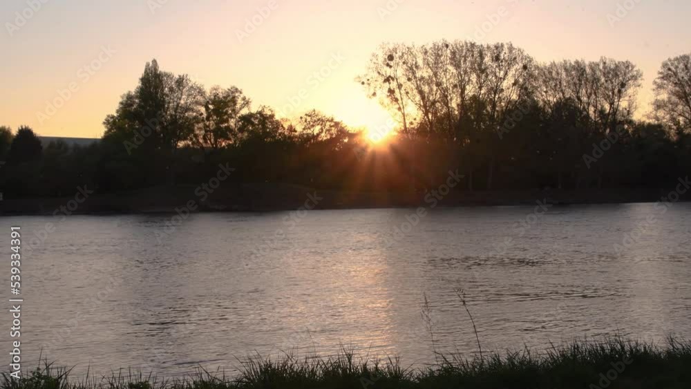 The river Rhine near Strasbourg in France at Sundown The river Rhine near Strasbourg in France at Sundown