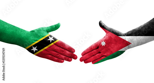 Handshake between Jordan and Saint Kitts and Nevis flags painted on hands, isolated transparent image.
