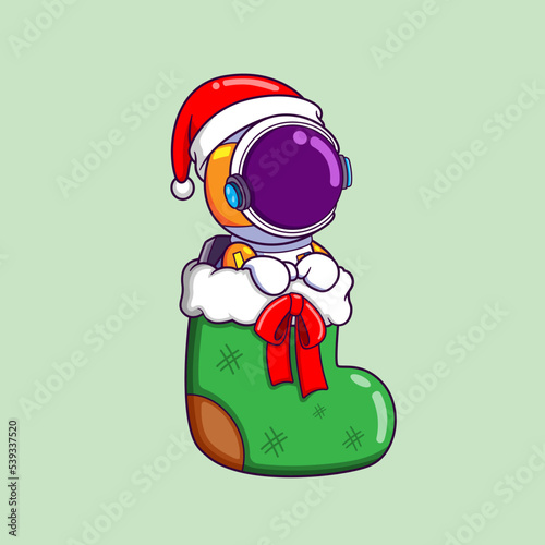 The cute astronaut is sitting on the christmas sock waiting for santa gift
