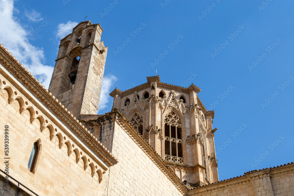 Stone monastery in a small town in Catalonia, in Spain, has a bell tower and a beautiful structure