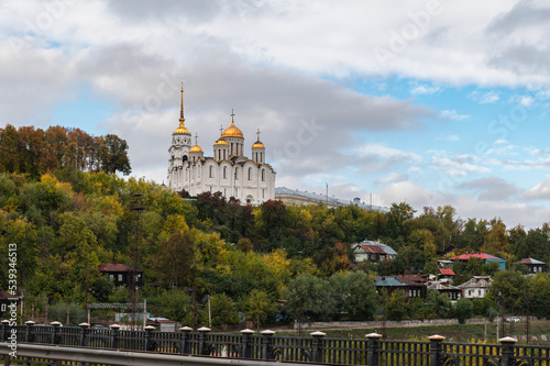 View of the Holy Assumption Cathedral and the old buildings of the city of Vladimir from the bridge on the Klyazma River. photo