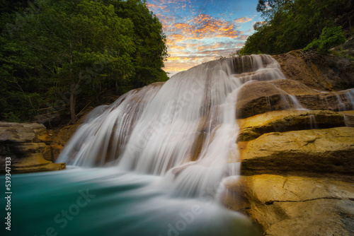 waterfall in the mountains © Didik