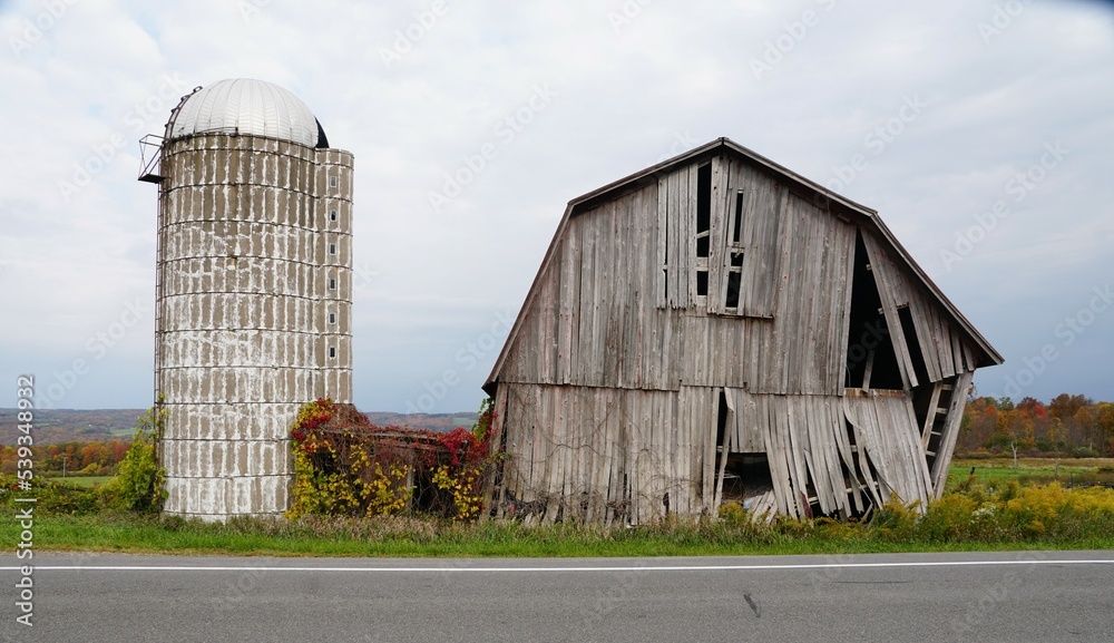 An abandoned farm the background of fall foliage near Upstate New York, U.S