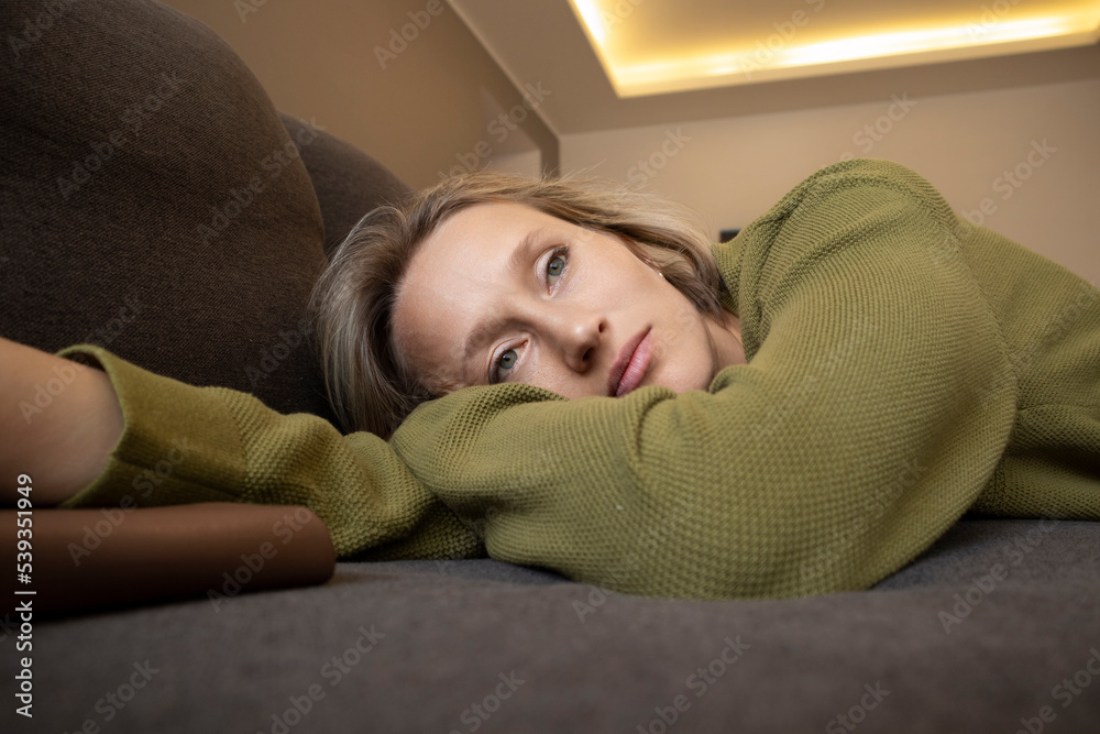young woman at home on sofa