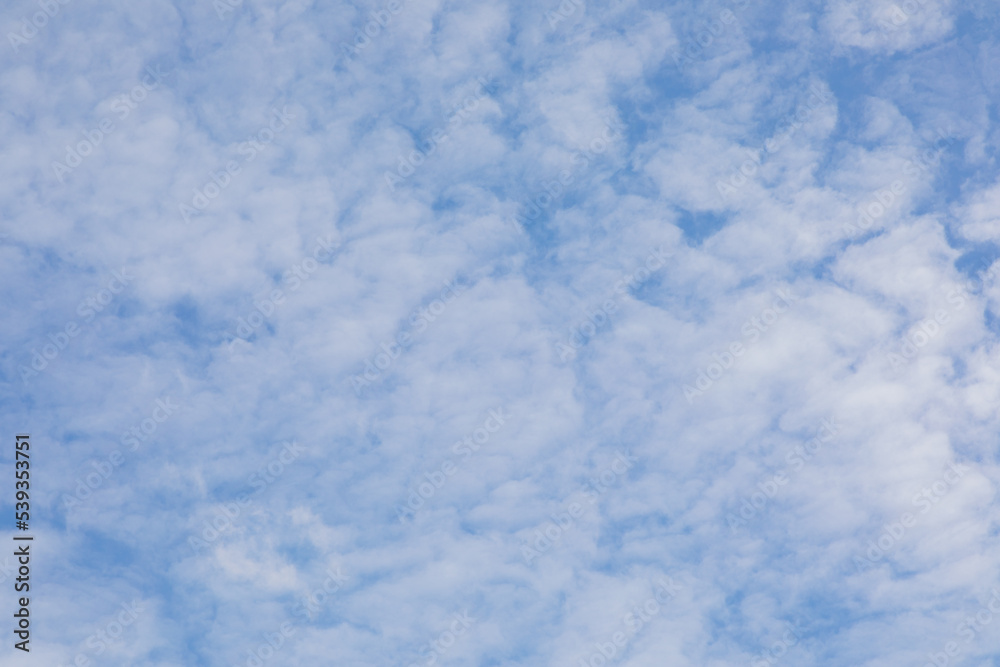 Cloudy daytime sky can be used as a background image.