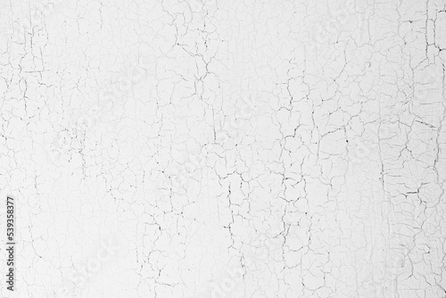 White wooden background, old wood board painted with white paint. Cracks textures on a paint, vintage backdrop