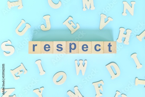 Respect core values concept in business, company and organization. Word typography on wooden blocks flat lay.