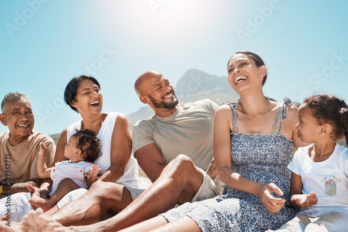 Big family, relax and happy at the beach and travel vacation together for summer, freedom and bonding lifestyle. Holiday, support and smile resting in sand with parents, grandparents and children