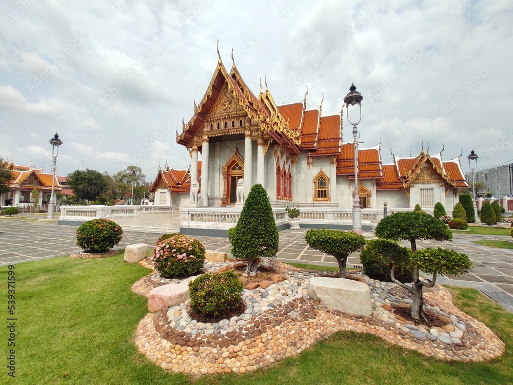 Wide angle of Wat Benchamabophit Dusitwanaram or marble temple, it is one of Bangkok's best-known temples and a major tourist attraction. Wide angle of Wat Benchamabophit Dusitwanaram or marble temple, it is one of Bangkok's best-known temples and a major tourist attraction.