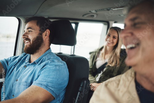 Family, travel and road trip with a man driving a car on holiday or vacation with his relatives as a passenger. Transport, driver and journey with a group of happy people traveling together