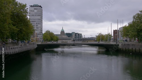 Rosie Hackett Bridge And Loopline Bridge Over Liffey River Near The SIPTU and The Custom House Buildings in Dublin, Ireland. - timelapse photo